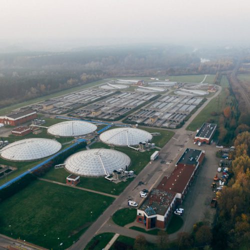Aerial shot of a wastewater treatment facility in Poznań, showcasing industrial technology and environmental effort.
